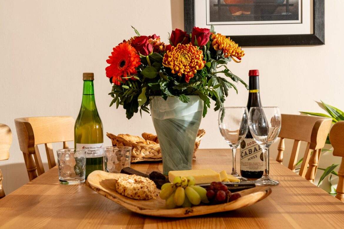 The Byre table set with wine, cheese, fruit, biscuits, flowers The Byre table set with wine, cheese, fruit, biscuits, flowers Field House