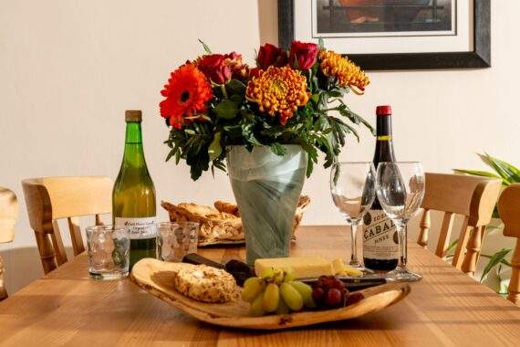 The Byre table set with wine, cheese, fruit, biscuits, flowers The Byre table set with wine, cheese, fruit, biscuits, flowers Field House